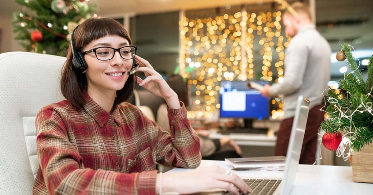 Woman working at support during the holidays